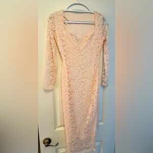Beautiful pale pink lace dress. Very form fitting, definitely eye catching!